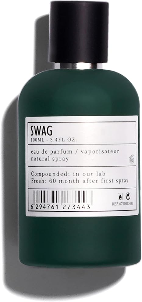 Green perfume bottle labeled 'SWAG' on a dark background